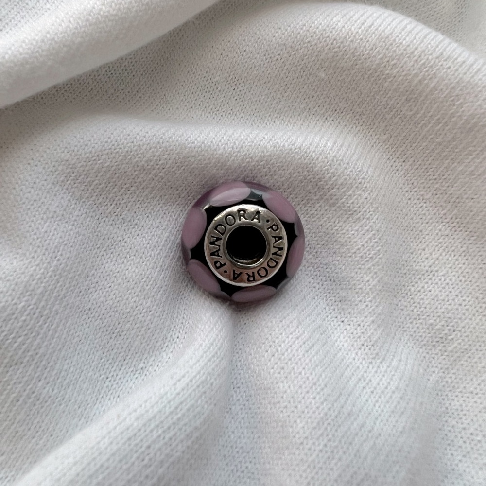 Authentic pandora 925 silver and glass round threaded core charm in purple.